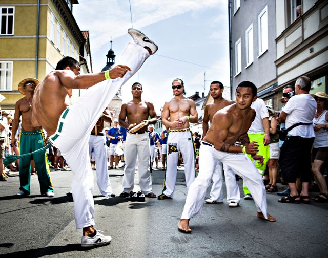 COBURG, GERMANY - JULY 11: The unidentified male capoeira dancers participates at the annual samba festival in Coburg, Germany on July 11, 2010.